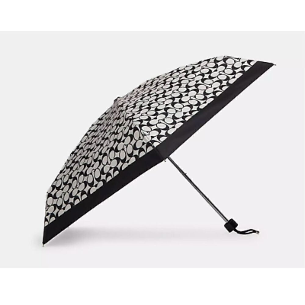 Coach black white travel compact umbrella w/pom pom wristlet